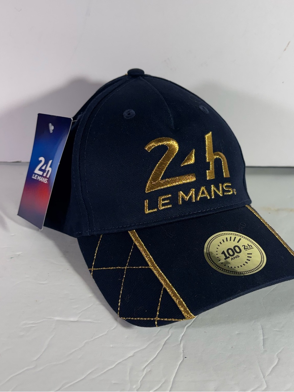 Le Mans 100th Anniversary Cap with Gold Stitching and detail Accents.